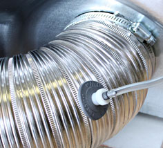 Tap Fitting in Flex Hose Connected to Dryer